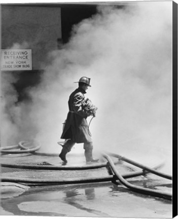 Framed Firefighter walking in front of smoke Print