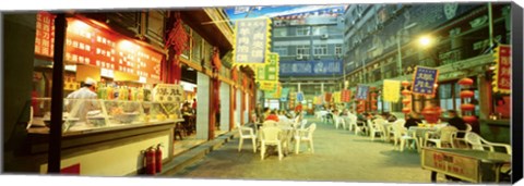 Framed Group of people sitting outside a restaurant, Beijing, China Print