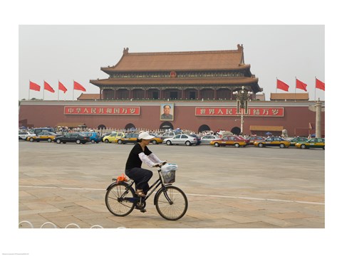 Framed Tourist riding a bicycle at a town square, Tiananmen Gate Of Heavenly Peace, Tiananmen Square, Beijing, China Print