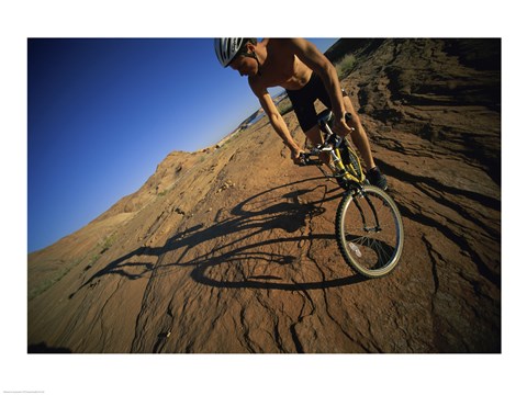 Framed Low angle view of a man mountain biking, Utah, USA Print
