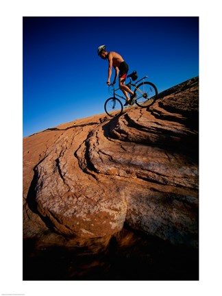 Framed Low angle view of a man mountain biking, Utah, USA Print
