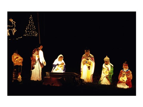 Framed Figurines depicting nativity scene lit up at night Print