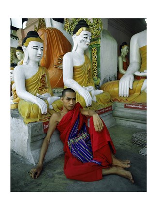 Framed Monk Sitting in Front of a Buddha Statue Print