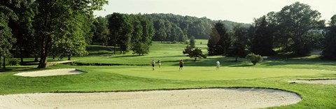 Framed Four people playing on a golf course, Baltimore County, Maryland, USA Print