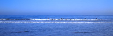 Framed Surfers riding a wave in the sea, Santa Monica, Los Angeles County, California, USA Print
