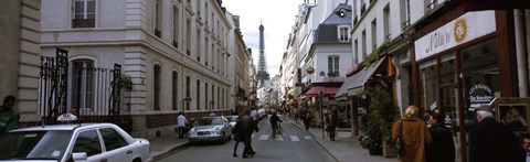 Framed Buildings along a street with a tower in the background, Rue Saint Dominique, Eiffel Tower, Paris, Ile-de-France, France Print