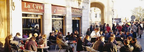 Framed Tourists sitting outside of a cafe, Barcelona, Spain Print