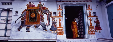 Framed Young woman standing at the door, Udaipur, Rajasthan, India Print