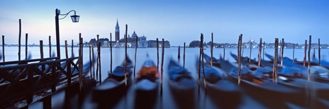 Framed Row of gondolas moored near a jetty, Venice, Italy Print