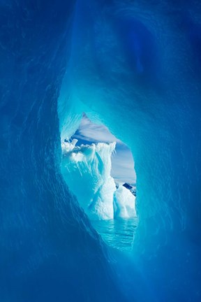 Framed Antarctica, Iceberg framed in arch of another in Wilhelmina Bay. Print