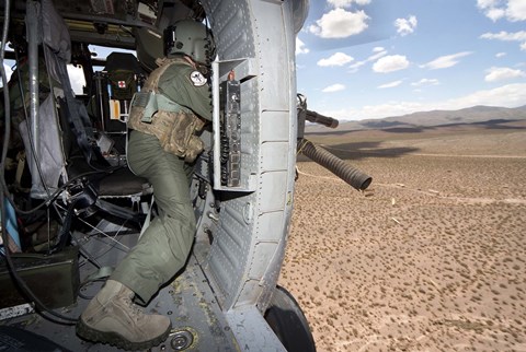 Framed HH-60G Pave Hawk gunner fires his GAU-17 machine gun Print