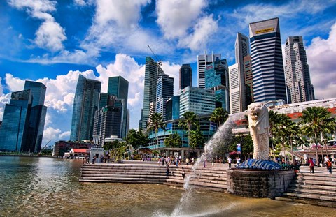 Framed Merlion, symbol of Singapore, and downtown skyline in Fullerton area of Clarke Quay. Print