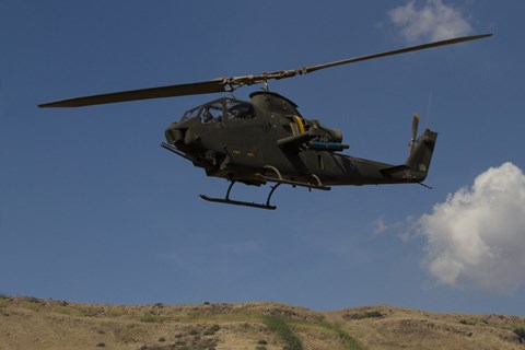 Framed AH-1F Tzefa of the Israeli Air Force flying over the Golan Heights, Israel Print