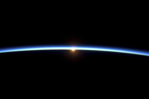 Framed Thin line of Earth&#39;s Atmosphere and the Setting Sun Print