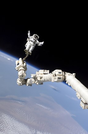 Framed Astronaut Anchored to a Foot Restraint on the International Space Stations Canadarm2 Print