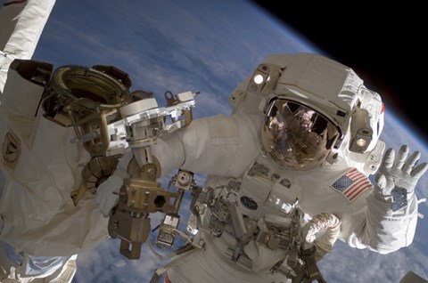 Framed Astronaut Waves to the Camera While Participating in a Session of Extravehicular Activity Print