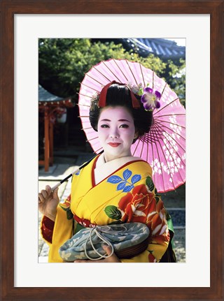 Framed Geisha holding a parasol, Kyoto, Japan Print