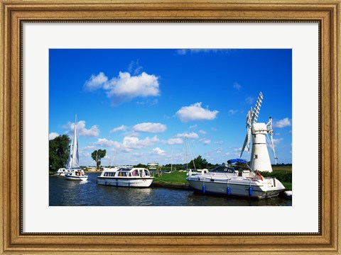 Framed Boats moored near a traditional windmill, River Thurne, Norfolk Broads, Norfolk, England Print