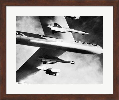 Framed Low angle view of a bomber plane carrying missiles during fight, AGM-28 Hound Dog, B-52 Stratofortress Print