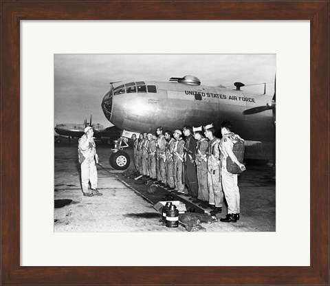 Framed Group of army soldiers standing in a row near a fighter plane, B-29 Superfortress Print
