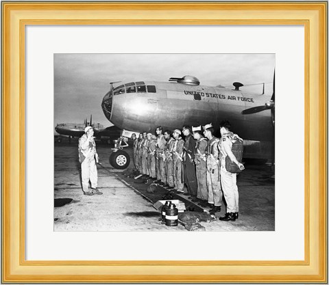 Framed Group of army soldiers standing in a row near a fighter plane, B-29 Superfortress Print