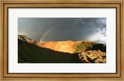 Framed Crater of an extinct volcano with a rainbow in the sky Print