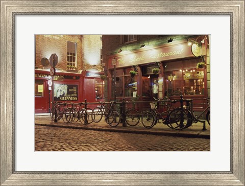Framed Bicycles parked in front of a restaurant at night, Dublin, Ireland Print