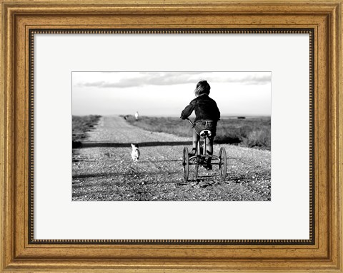 Framed Rear view of a girl riding a bicycle Print