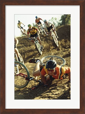 Framed Young man falling off his bicycle in a race Print