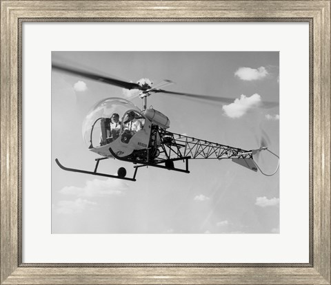 Framed Low angle view of two people sitting in a helicopter, Bell 47G-2 Print
