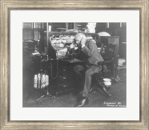 Framed Thomas Alva Edison using his dicatating machine Print