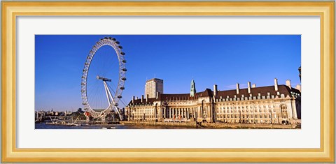 Framed Ferris wheel with buildings at the waterfront, River Thames, Millennium Wheel, London County Hall, London, England Print