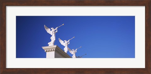 Framed Low angle view of statues on a wall, Caesars Place, Las Vegas, Nevada, USA Print