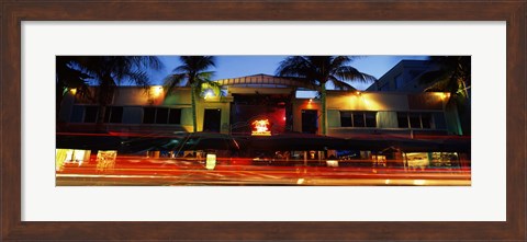 Framed Traffic in front of a building at dusk, Art Deco District, South Beach, Miami Beach, Miami-Dade County, Florida, USA Print