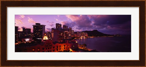 Framed Buildings lit up at dusk, Waikiki, Oahu, Hawaii, USA Print