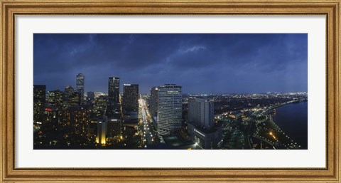 Framed High angle view of buildings in a city lit up at night, New Orleans, Louisiana, USA Print