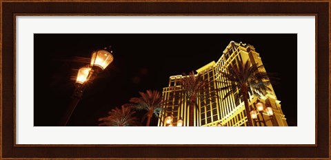 Framed Low angle view of a hotel lit up at night, The Strip, Las Vegas, Nevada, USA Print