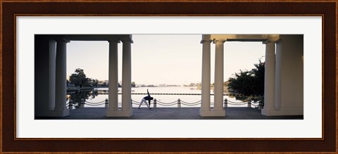 Framed Person stretching near colonnade, Lake Merritt, Oakland, Alameda County, California, USA Print