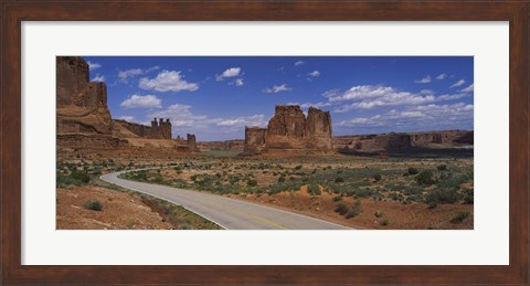Framed Empty road running through a national park, Arches National Park, Utah, USA Print