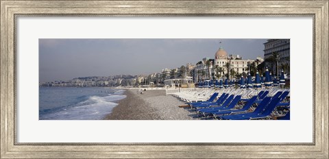 Framed Empty lounge chairs on the beach, Nice, French Riviera, France Print