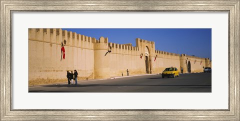 Framed Car on a road in front of a fortified wall, Medina, Kairwan, Tunisia Print