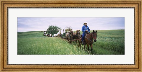 Framed Historical reenactment of covered wagons in a field, North Dakota, USA Print