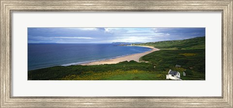 Framed Birds-eye view of sea, white stone cottage, Northern Ireland. Print
