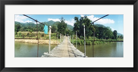 Framed Old wooden bridge across the river, Chiang Mai Province, Thailand Print