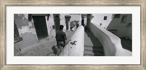 Framed Rear view of a man walking in front of a building, Casaba, Algiers, Algeria Print