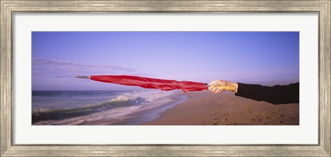 Framed Close-up of a woman&#39;s hand pointing with a red umbrella, Point Reyes National Seashore, California, USA Print