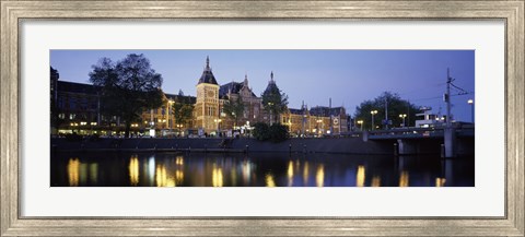 Framed Reflection of a railway station in water, Amsterdam Central Station, Amsterdam, Netherlands Print