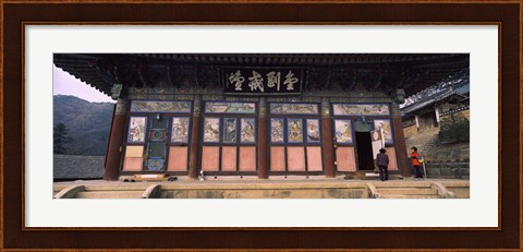 Framed Buddhist temple with a mountain range in the background, Kayasan Mountains, Haeinsa Temple, Gyeongsang Province, South Korea Print