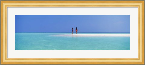 Framed Two women standing on the beach sandbar, Maayafushi Island, Ari Atoll, Maldives Print