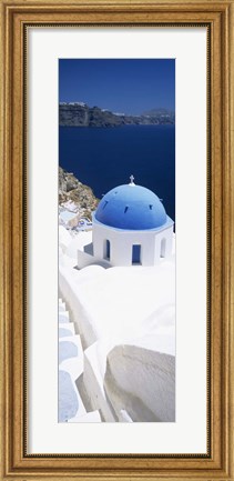 Framed High angle view of a church with blue dome, Oia, Santorini, Cyclades Islands, Greece Print